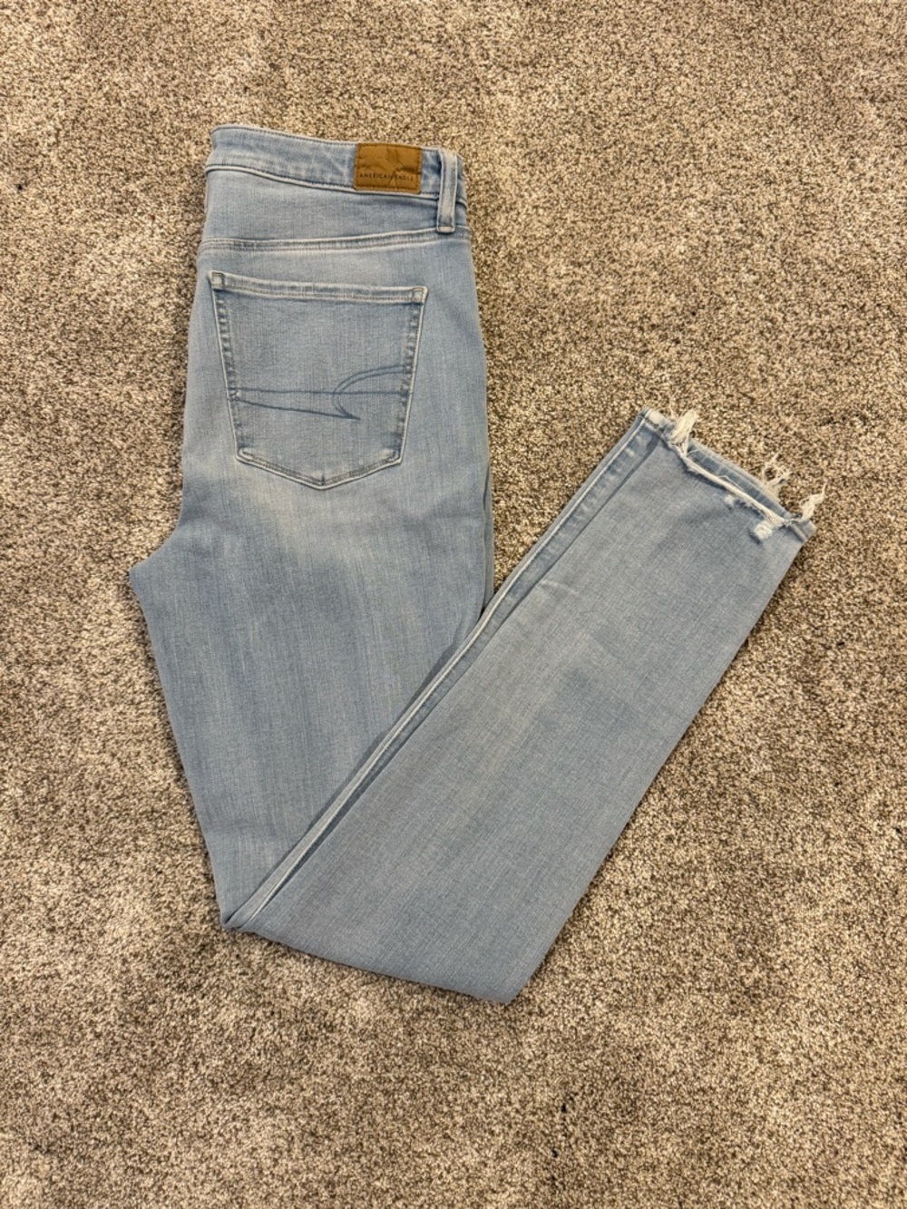 American Eagle Outfitters Pale Blue High-Rise Skinny Jeans with Raw Hem